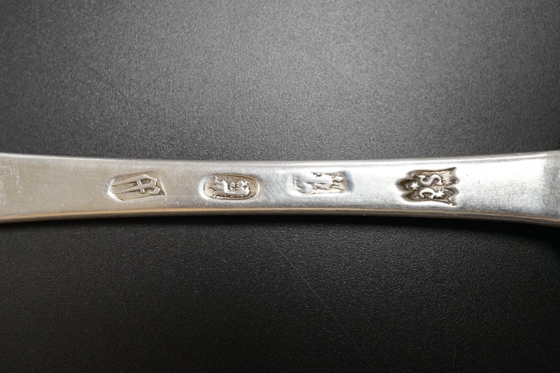 A late William III Britannia standard silver trefid spoon, by William Scarlett, London, 1701, with rat-tail bowl and later? engraved crest, 19.7cm, 52 grams.